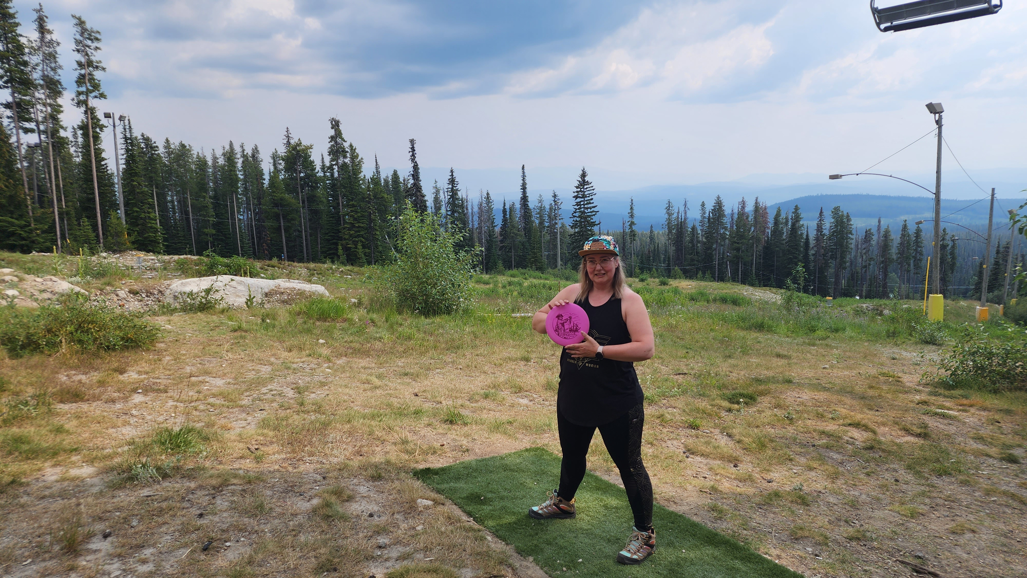 Mountain landscape with a disc golf basket silhouette